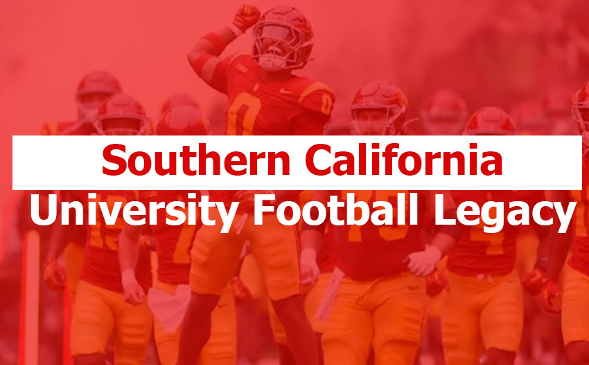 Southern California University football team running onto the field at Los Angeles Memorial Coliseum in cardinal and gold uniforms.